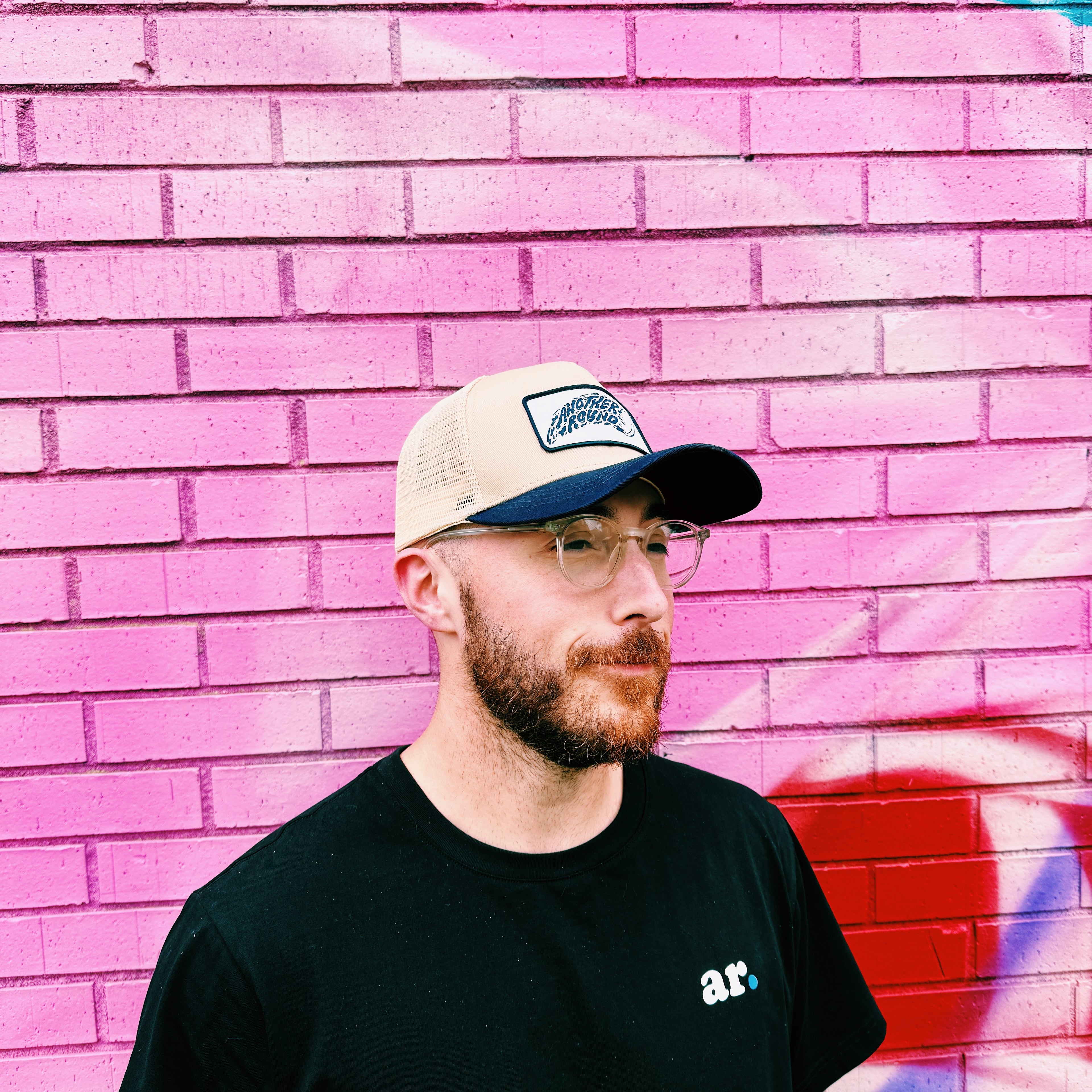 Another Round Shred Trucker hat in navy and tan